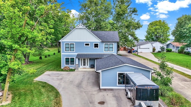 view of front facade featuring a front yard and a garage