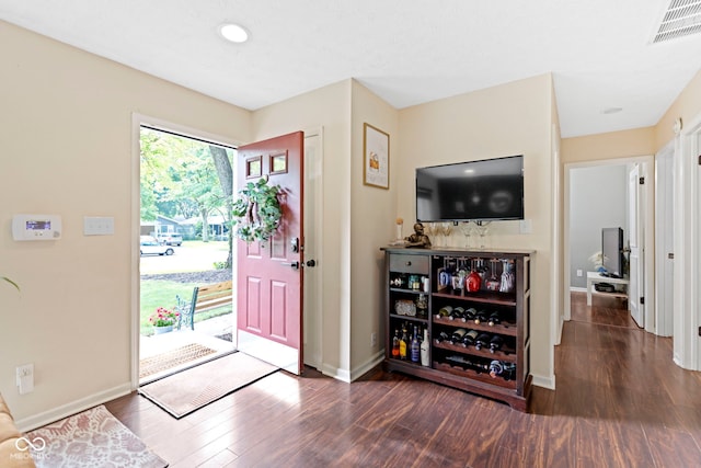 foyer entrance featuring dark wood-type flooring