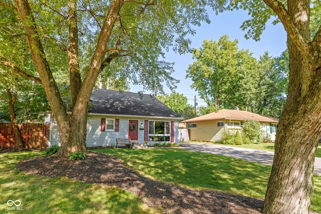 ranch-style house with a front yard