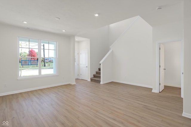 unfurnished living room featuring light hardwood / wood-style floors