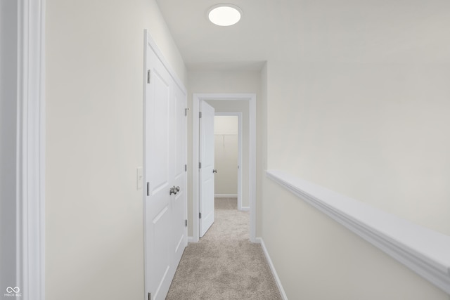 hallway with light carpet