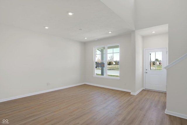 foyer with a wealth of natural light and light hardwood / wood-style floors