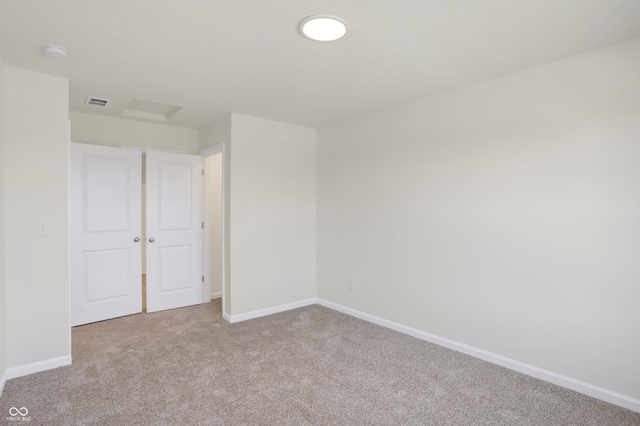 spare room with light colored carpet