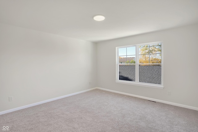 empty room with carpet flooring