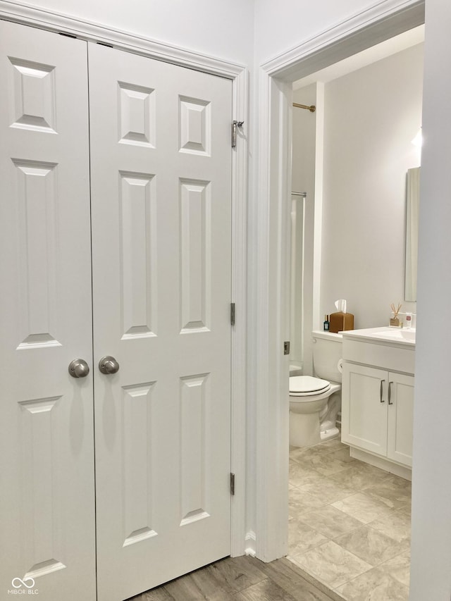 bathroom with toilet and vanity