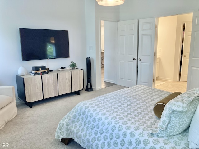 bedroom with light carpet and baseboards