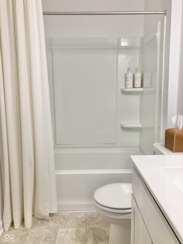 bathroom with shower / tub combo, vanity, and toilet