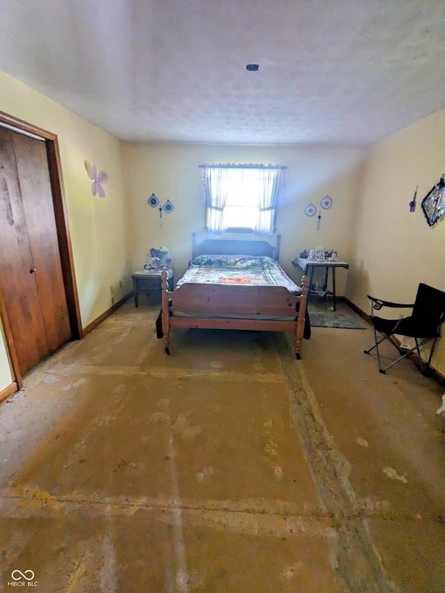 bedroom featuring baseboards