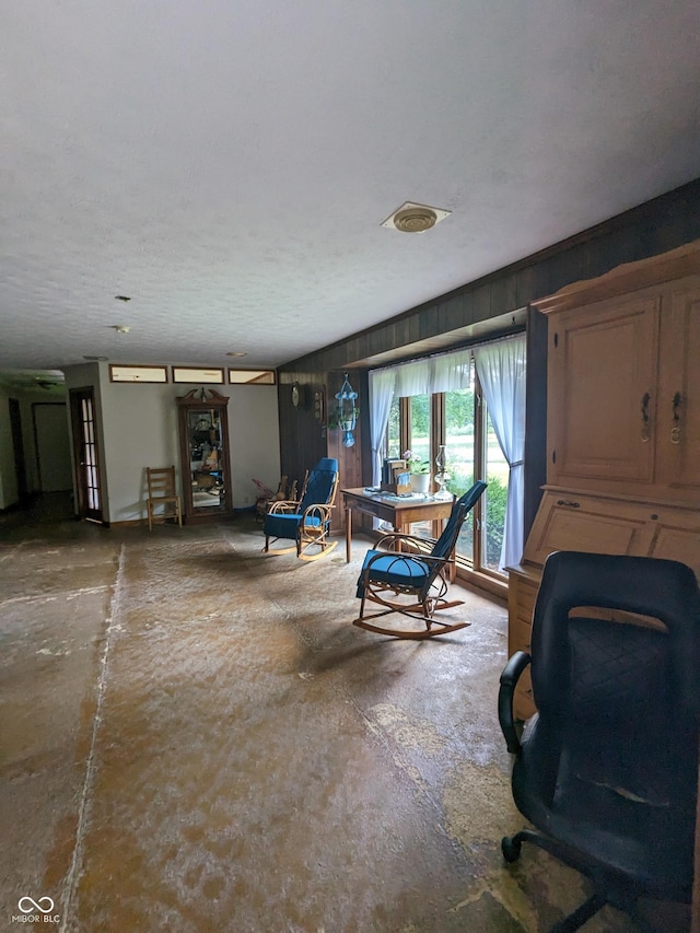 interior space featuring a textured ceiling and visible vents