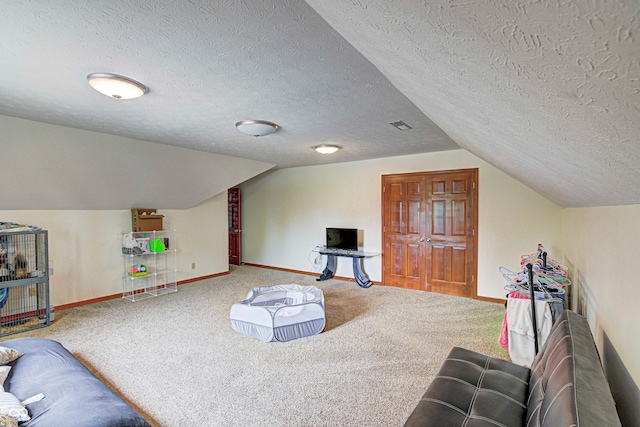 living room featuring a textured ceiling, carpet flooring, and lofted ceiling