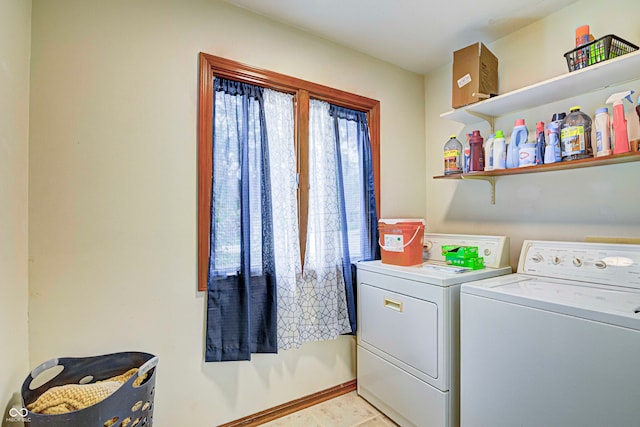 laundry area featuring light tile patterned floors and independent washer and dryer