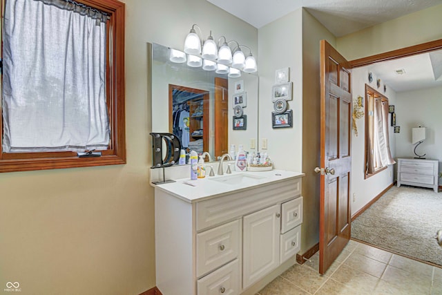 bathroom featuring tile patterned floors and vanity