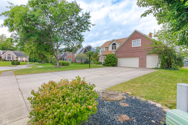 view of front of home featuring a front yard and a garage