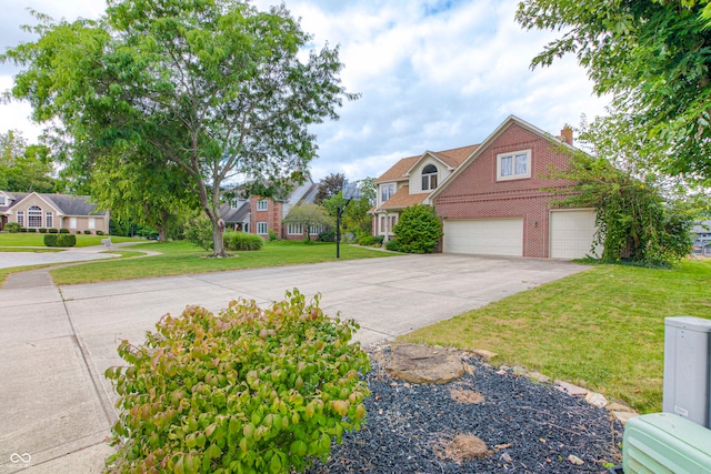 view of front of property featuring a garage and a front lawn