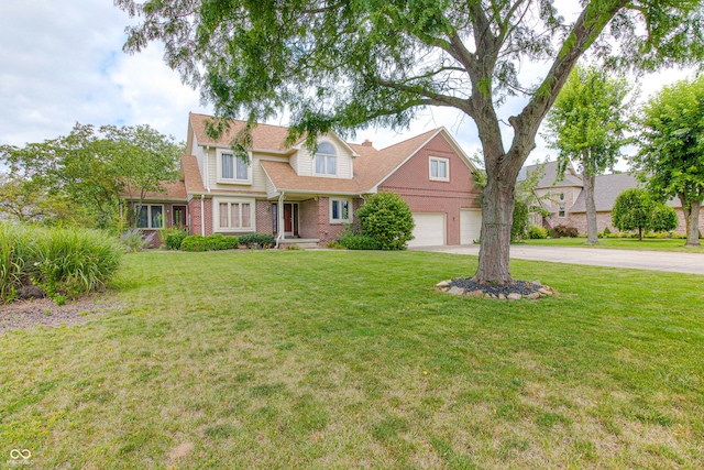 view of front of property with a front yard and a garage