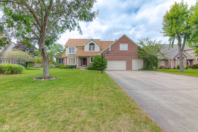 view of front of property with a front yard and a garage