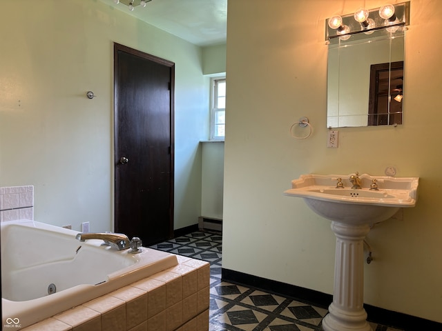 bathroom featuring tile patterned floors and tiled tub