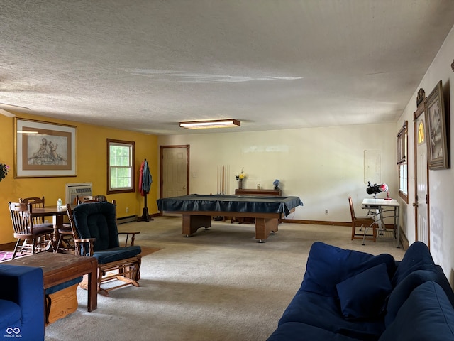 game room featuring billiards, a textured ceiling, a baseboard heating unit, and light carpet