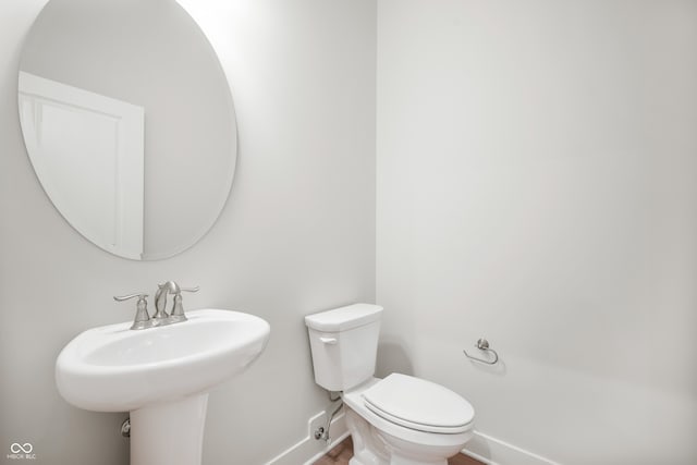 bathroom with toilet and sink