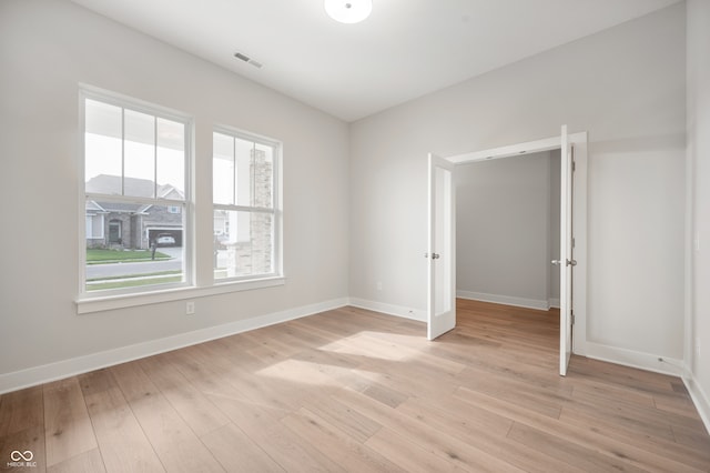 unfurnished bedroom with light hardwood / wood-style flooring