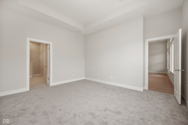 unfurnished bedroom with light carpet