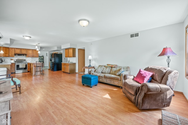 living room with light hardwood / wood-style floors