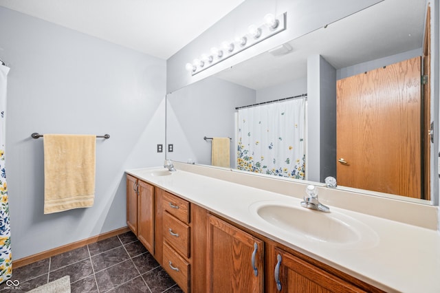 1936 Broadmoor Ln, Columbus, IN 47203 - bathroom with double vanity, baseboards, and a shower with curtain