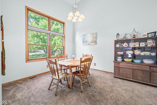 1936 Broadmoor Ln, Columbus, IN 47203 - carpeted dining space with a chandelier, baseboards, and lofted ceiling