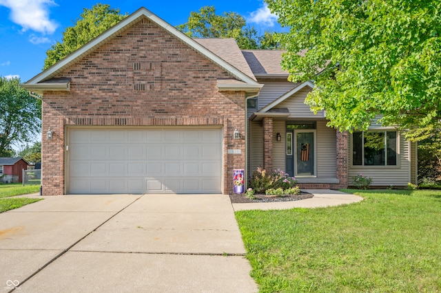 view of front of property with a front lawn and a garage