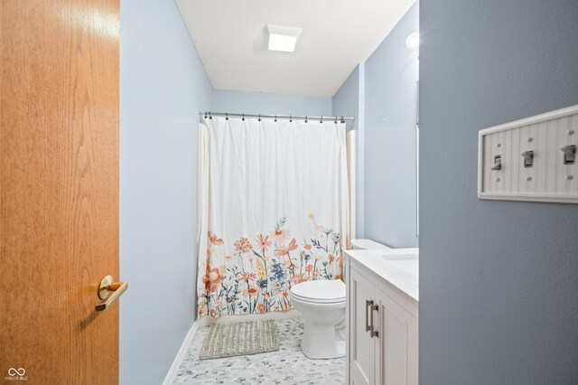 bathroom with vanity, a shower with shower curtain, toilet, and tile patterned flooring