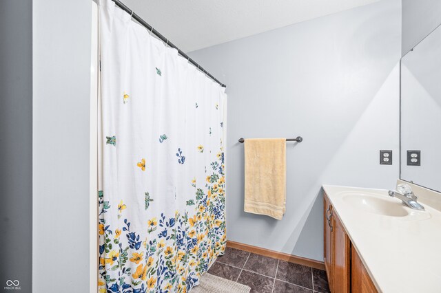 bathroom featuring vanity, tile patterned floors, and a shower with shower curtain