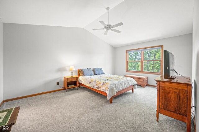 bedroom with carpet, vaulted ceiling, and ceiling fan