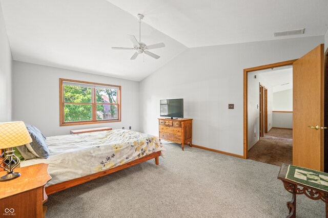 bedroom with ceiling fan, carpet, and vaulted ceiling