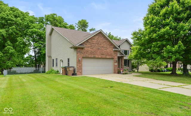 1936 Broadmoor Ln, Columbus, IN 47203 - view of front of house with brick siding, a chimney, driveway, and a garage