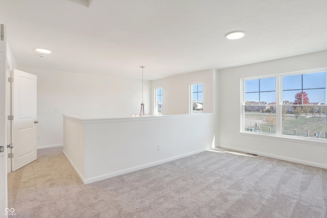 empty room featuring light colored carpet