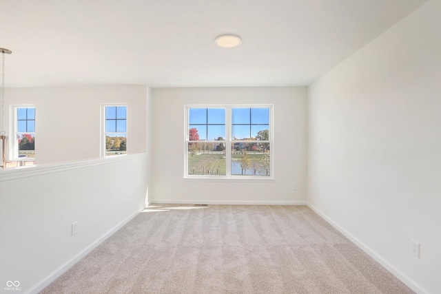 empty room featuring light carpet