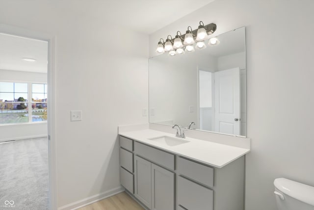 bathroom with vanity and toilet