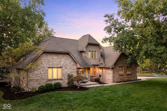 view of front of home with a lawn