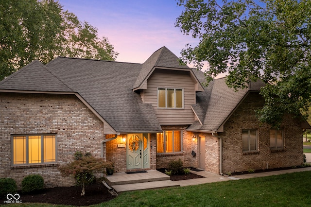 view of front of house with a lawn