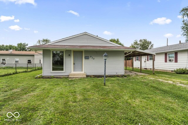 rear view of house with a lawn