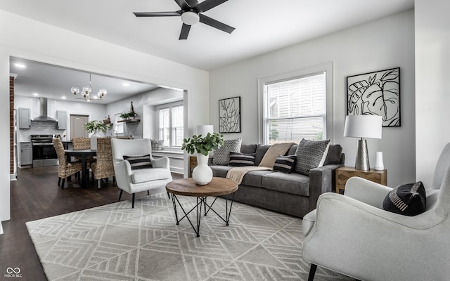 1210 Finley Ave, Indianapolis, IN 46203 - living room featuring a chandelier, ceiling fan, and wood finished floors