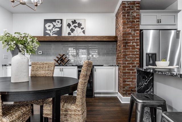 1210 Finley Ave, Indianapolis, IN 46203 - dining room featuring dark wood-type flooring, a chandelier, and wine cooler