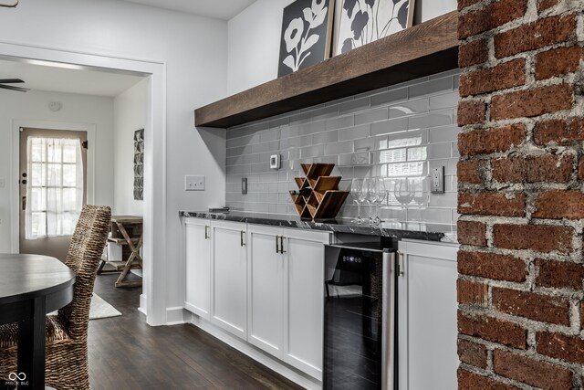 1210 Finley Ave, Indianapolis, IN 46203 - indoor dry bar with beverage cooler, dark wood-style flooring, tasteful backsplash, and healthy amount of natural light