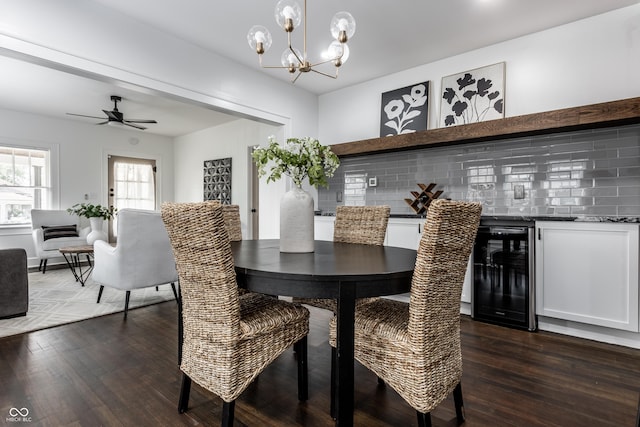 1210 Finley Ave, Indianapolis, IN 46203 - dining space with beverage cooler, dark wood finished floors, a chandelier, and ceiling fan