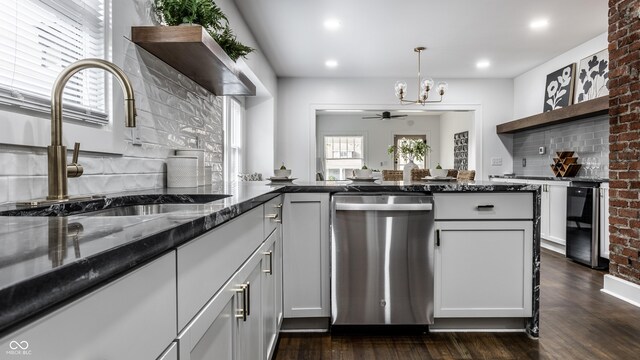 1210 Finley Ave, Indianapolis, IN 46203 - kitchen with dishwasher, a sink, open shelves, a chandelier, and dark wood-style flooring