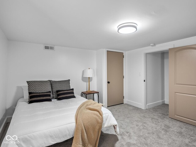 1210 Finley Ave, Indianapolis, IN 46203 - bedroom featuring light carpet and baseboards