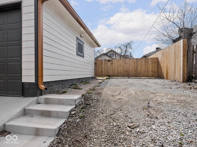 1210 Finley Ave, Indianapolis, IN 46203 - view of home's exterior featuring fence and a garage