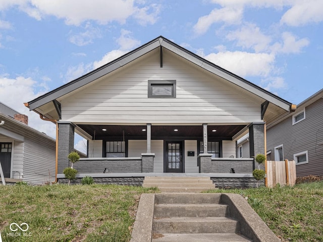 1210 Finley Ave, Indianapolis, IN 46203 - view of front facade with covered porch and fence