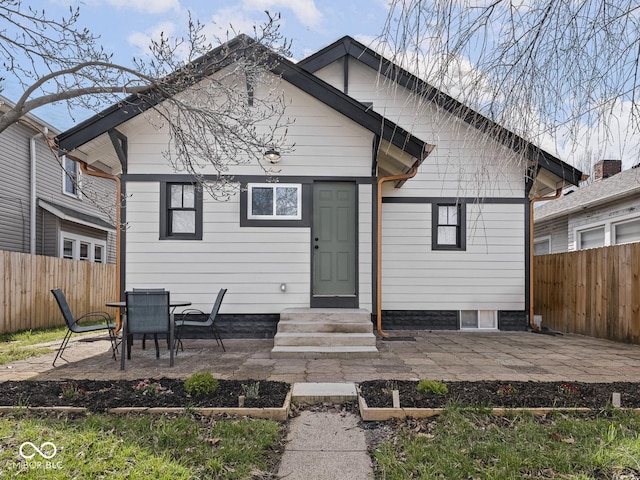 1210 Finley Ave, Indianapolis, IN 46203 - rear view of house with a patio area and a fenced backyard