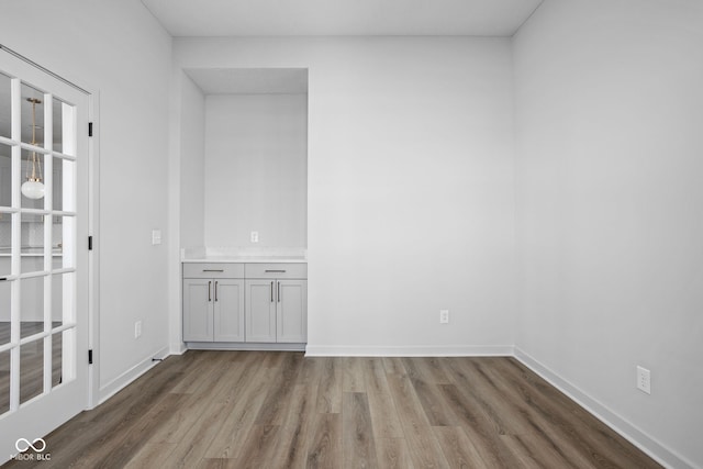 spare room featuring hardwood / wood-style flooring